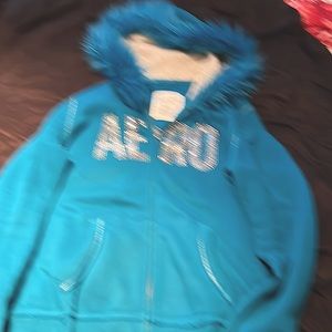 Blue hoodie very cute.